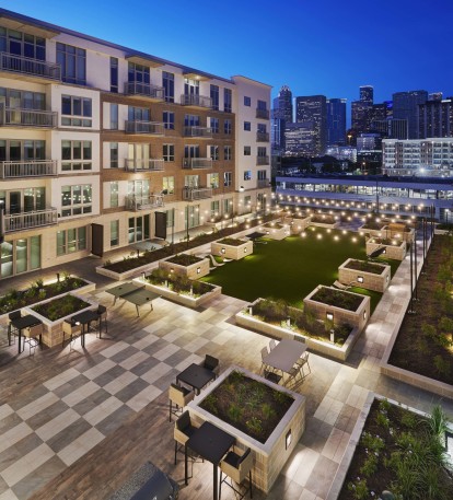 Outdoor lounge with downtown view night