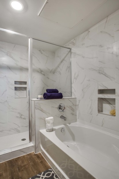 Villas bathroom tub and walk-in shower
