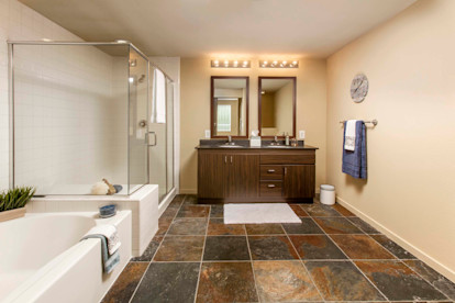 Ensuite bathroom with stand alone walk in shower and garden tub and double sink vanity