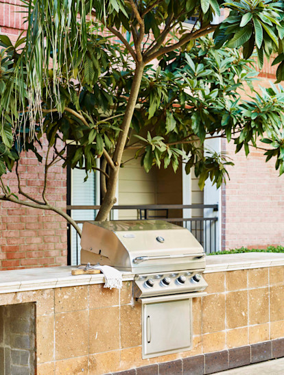 Poolside barbeque grills at Camden Plaza Apartments in Houston, TX 