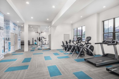 24-hour fitness center with cardio machines at Camden Farmers Market apartments in Dallas, TX