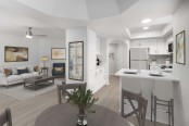 Open-concept dining area near kitchen with white quartz countertops