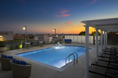 Camden NoMa apartments in Washington D.C. rooftop pool at sunset. 