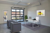 Live/work space with glass-paneled garage door at Camden RiNo apartments in Denver, CO
