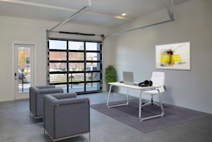 Live/work space with glass-paneled garage door at Camden RiNo apartments in Denver, CO