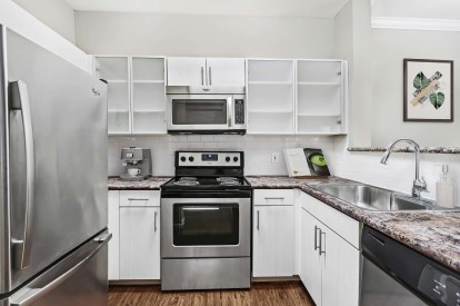 Kitchen with stainless steel appliances and electric range