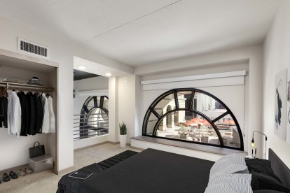 Loft style living space with arched window in live work home