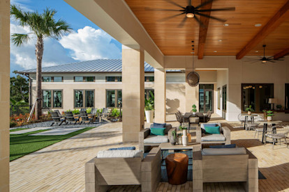 Camden Clearwater apartments outdoor resident lounge with outdoor seating and firepit