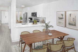 Open-concept dining and kitchen space in the Alberti floorplan at Camden Portofino in Pembrooke Pines, FL.