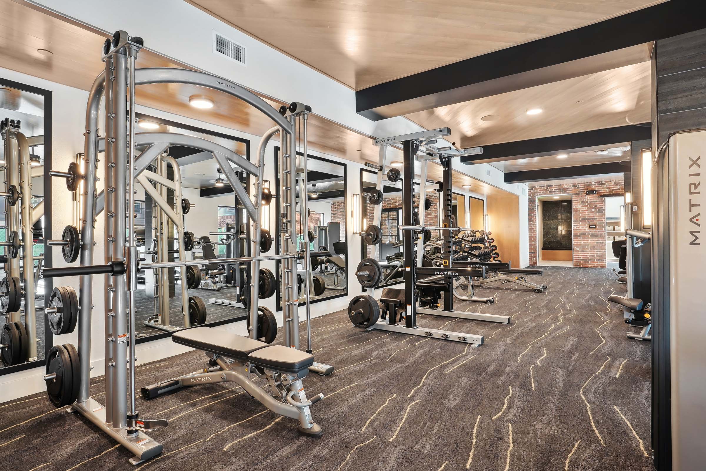 Fitness center with weight lifting equipment at Camden Roanoke apartments in Roanoke, TX