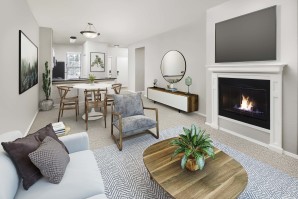 Open-concept living room with a fireplace Kitchen Camden Denver West Apartments in Golden, CO