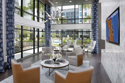 Surrounded by windows overlooking the pool deck, the resident lounge is a great place to gather with friends, have meetings, or get some work done.