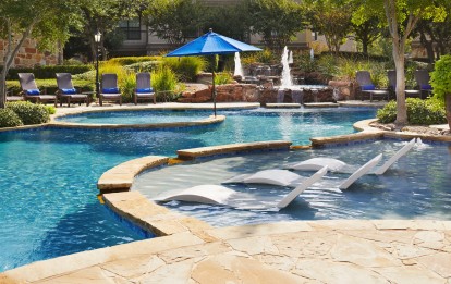 Resort style pool with lounge chairs