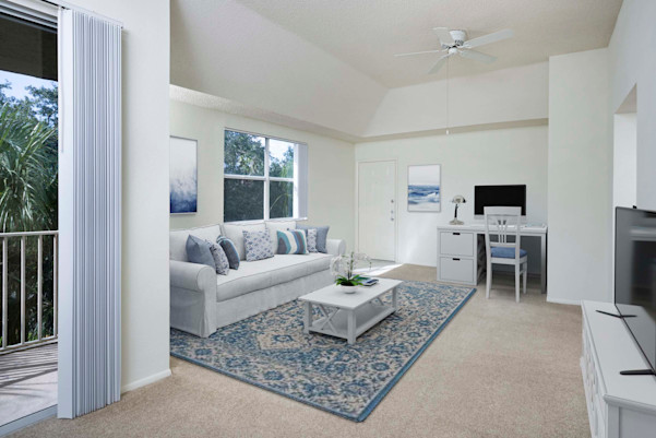 Apartment home living room with work from home space at Camden Plantation in Plantation, FL.