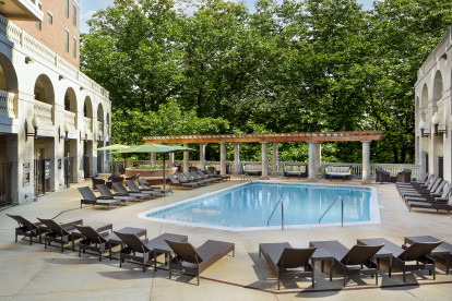 Pool at the towers with expansive sundeck and outdoor couches