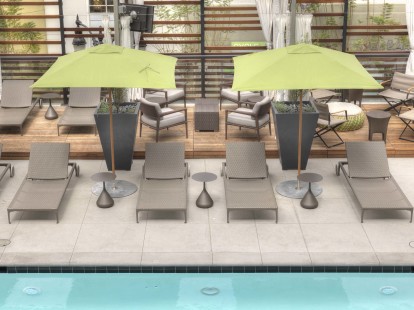Large pool deck with cabanas