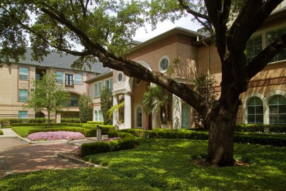 Leasing office exterior with green space at Camden Greenway Apartments in Houston, TX