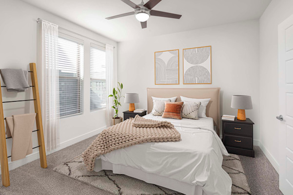 Flats bedroom with carpet and ceiling fan at Camden Greenville