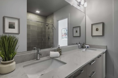 Townhome bathroom with double sink and white quartz countertops