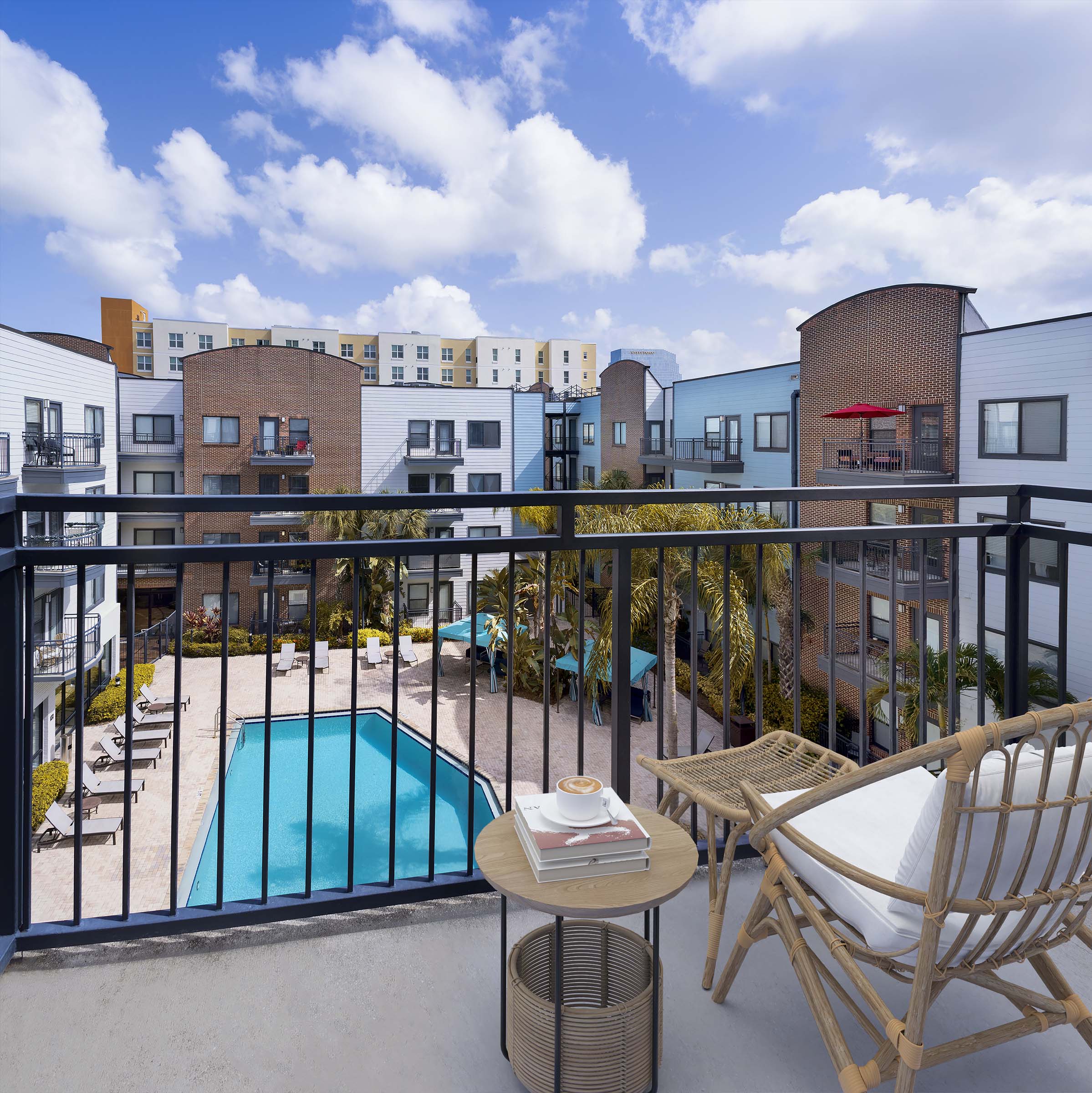 Private apartment balcony overlooking pool at Camden Orange Court apartments in Orlando, FL