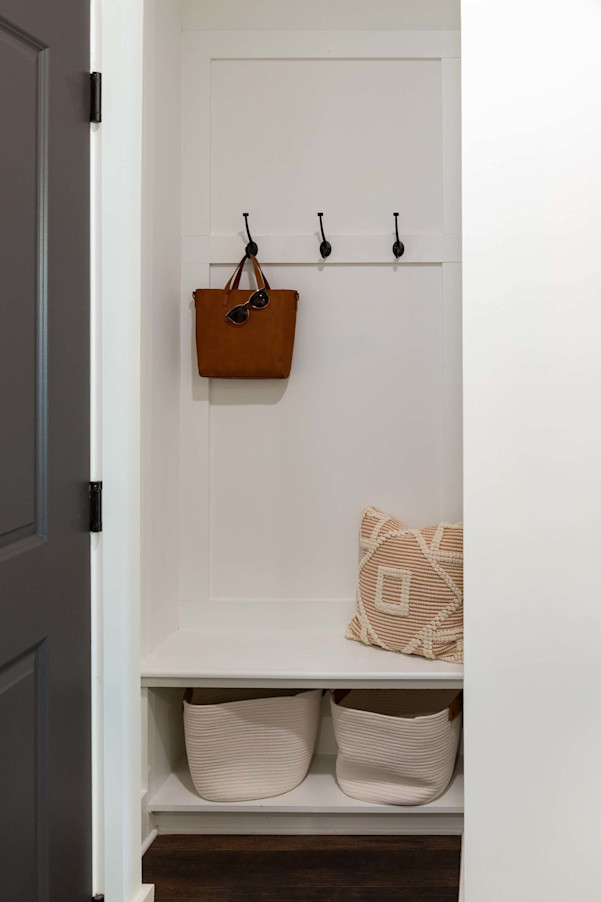 Mudroom entry with hooks and bench seat at Camden West Nashville apartments in Nashville, TN