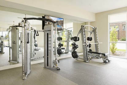 Fitness center with free weights at Camden Lincoln Station Apartments in Lone Tree, CO