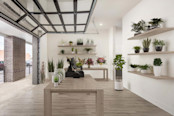 Plant shop business in live-work apartments that is accessible through a window paneled garage door at Camden RiNo Live-Work apartments in Denver, CO