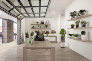 Plant shop business in live-work apartments that is accessible through a window paneled garage door at Camden RiNo Live-Work apartments in Denver, CO