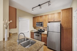 Kitchen with electric coil cooktop and stainless steel appliances