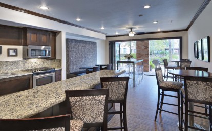Resident lounge with kitchen entertaining space at Camden Heights Apartments in Houston, TX