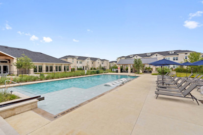 Pool and sundeck with tanning ledge at Camden Leander apartments in Leander, Tx