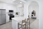 Renovated kitchen with herringbone backsplash at Camden St. Clair in Atlanta GA