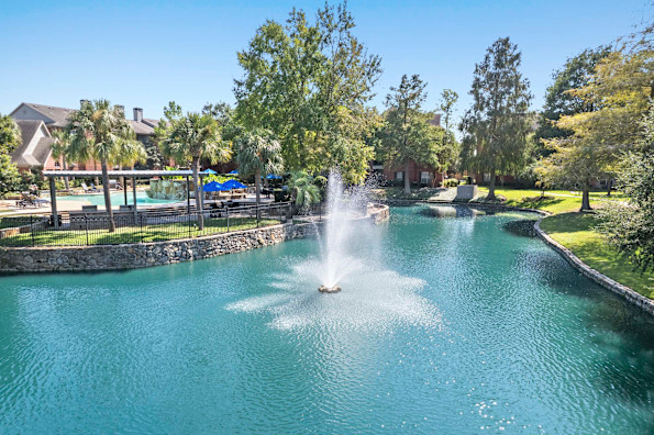 Private lake with water feature at Camden Holly Springs Apartments in Houston, Tx