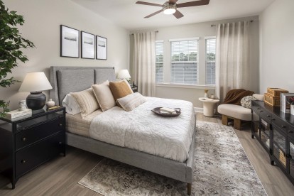 Spacious Bedrooms with Wood-Style Flooring at Camden Woodmill Creek Homes for Rent in Spring, TX