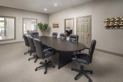 Conference room with meeting large table and chairs at Camden Amber Oaks