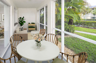 Screened-in covered patio in the Alberti floorplan at Camden Portofino in Pembroke Pines, FL.