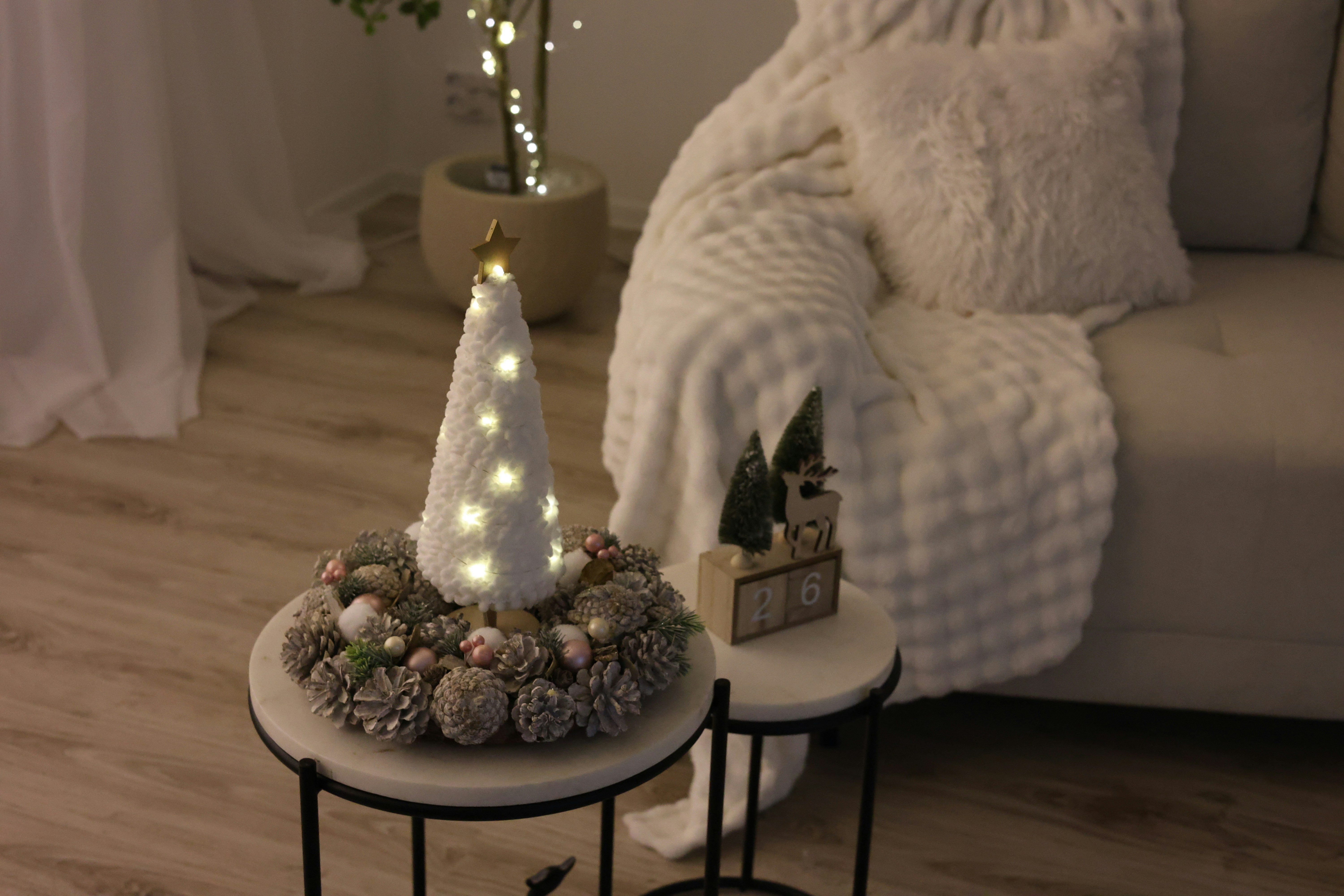 https://unsplash.com/photos/a-living-room-with-a-couch-and-a-christmas-tree--KckD64vD08