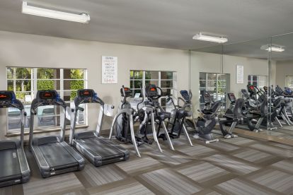 24-hour fitness center with cardio equipment