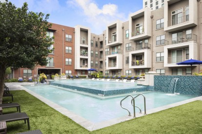 Resort style pool with water feature