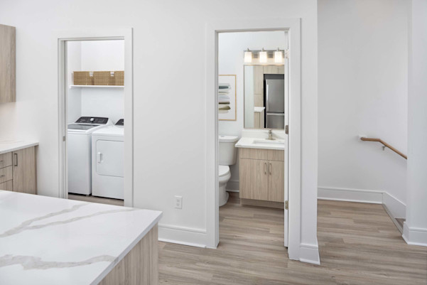 Townhome laundry room and half bathroom off the kitchen on the main floor at Camden Belmont apartments in Dallas, TX