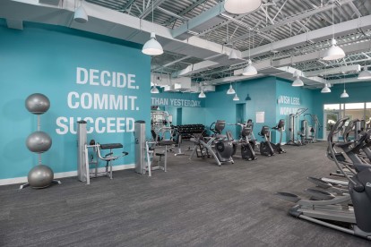 Expansive fitness center with cardio strength and circuit training equipment at Camden Brickell Apartments in Miami, FL.