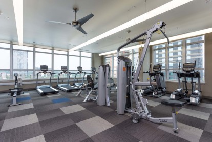 24 hour fitness center with cardio and strength training equipment