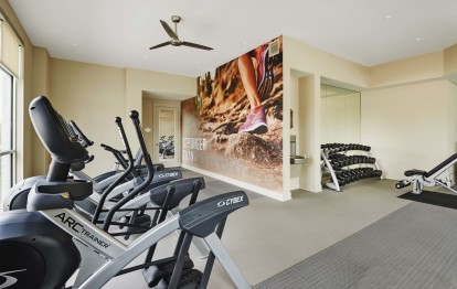 Fitness center with cardio equipment at Camden Lincoln Station Apartments in Lone Tree, CO