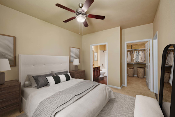 Bedroom with carpet, ceiling fan, walk-in closet, and ensuite bathroom at Camden Brushy Creek apartments in Cedar Park, TX