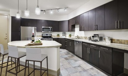 Contemporary style kitchen with island and tile flooring