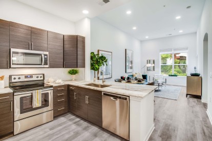 Kitchen open concept living natural light tall ceilings