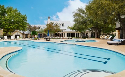 Spacious pool with lap lanes next to clubhouse at Camden Stoneleigh