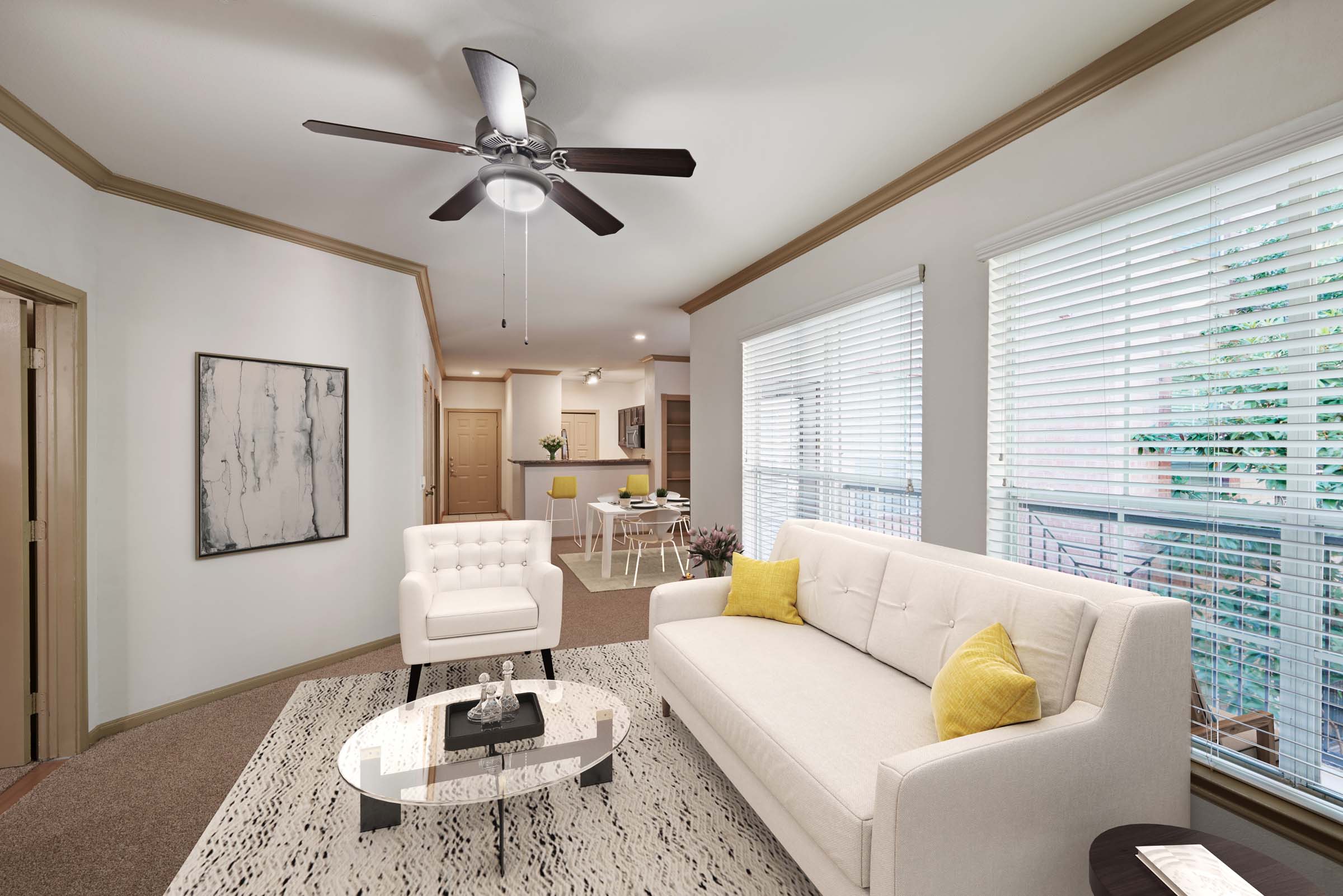 Open-concept living room with large windows and natural lighting at Camden Greenway Apartments in Houston, TX