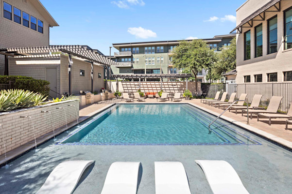Resort-style pool and sundeck on the Villas side at Camden Greenville apartments in Dallas, TX