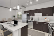 Large kitchen with stainless steel appliances and center island at Camden Asbury Village in Raleigh, NC